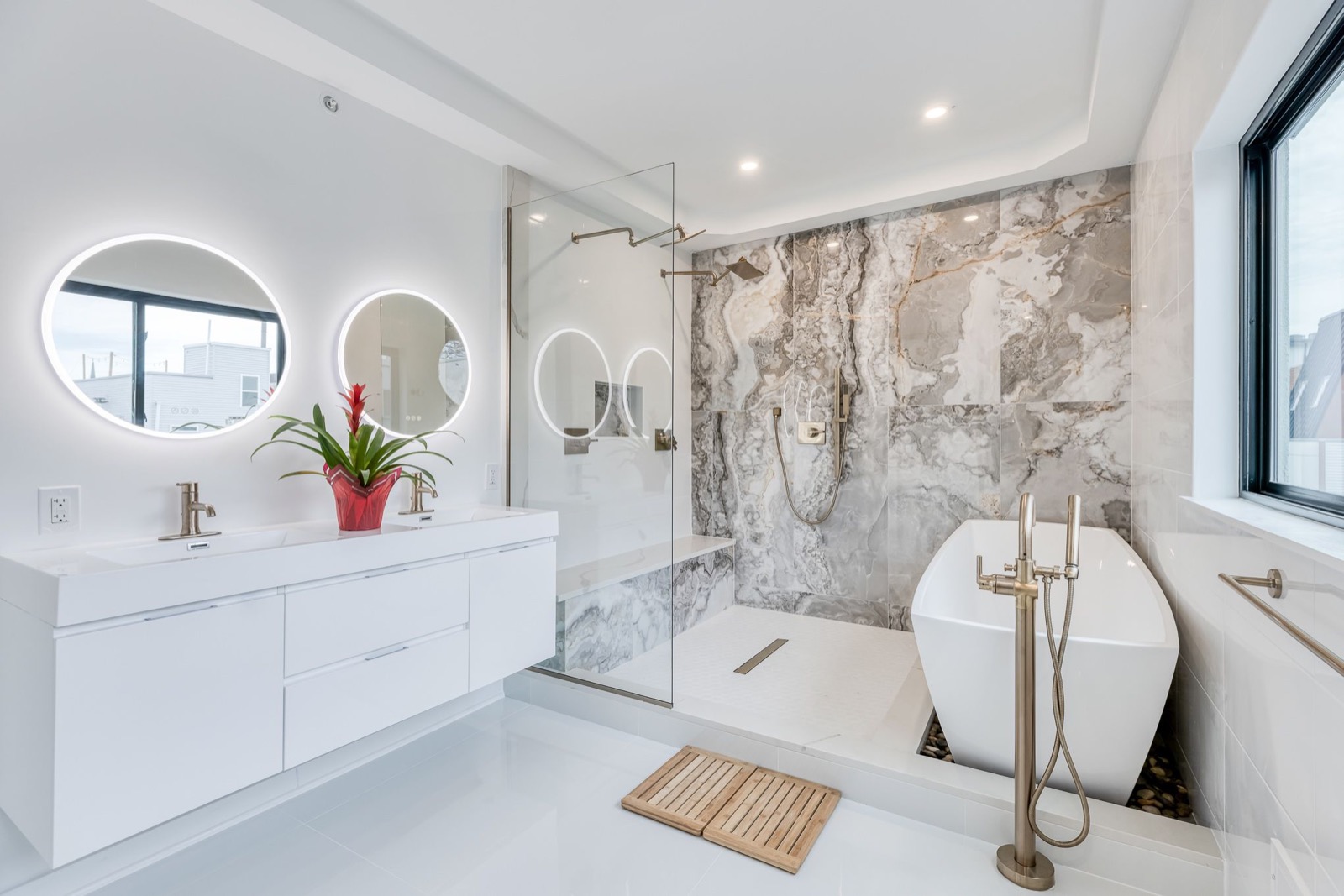 Floating double vanity with round LED mirrors