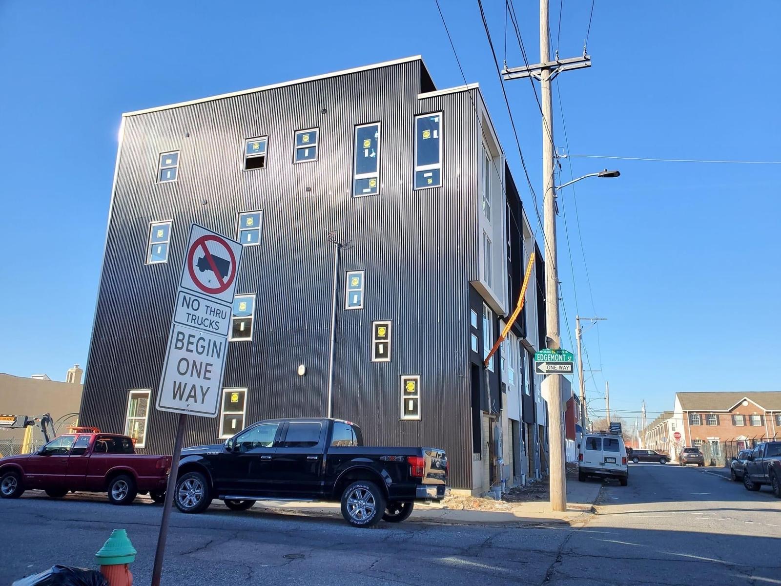 Side elevation with black siding during construction