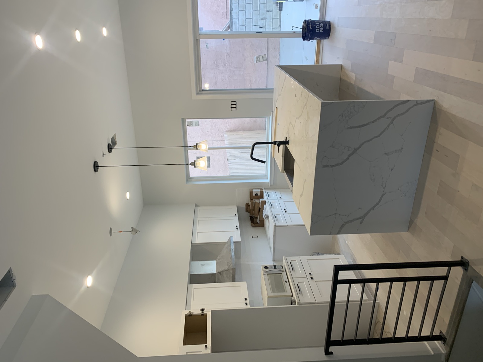 Kitchen island with pendants and sliding patio door