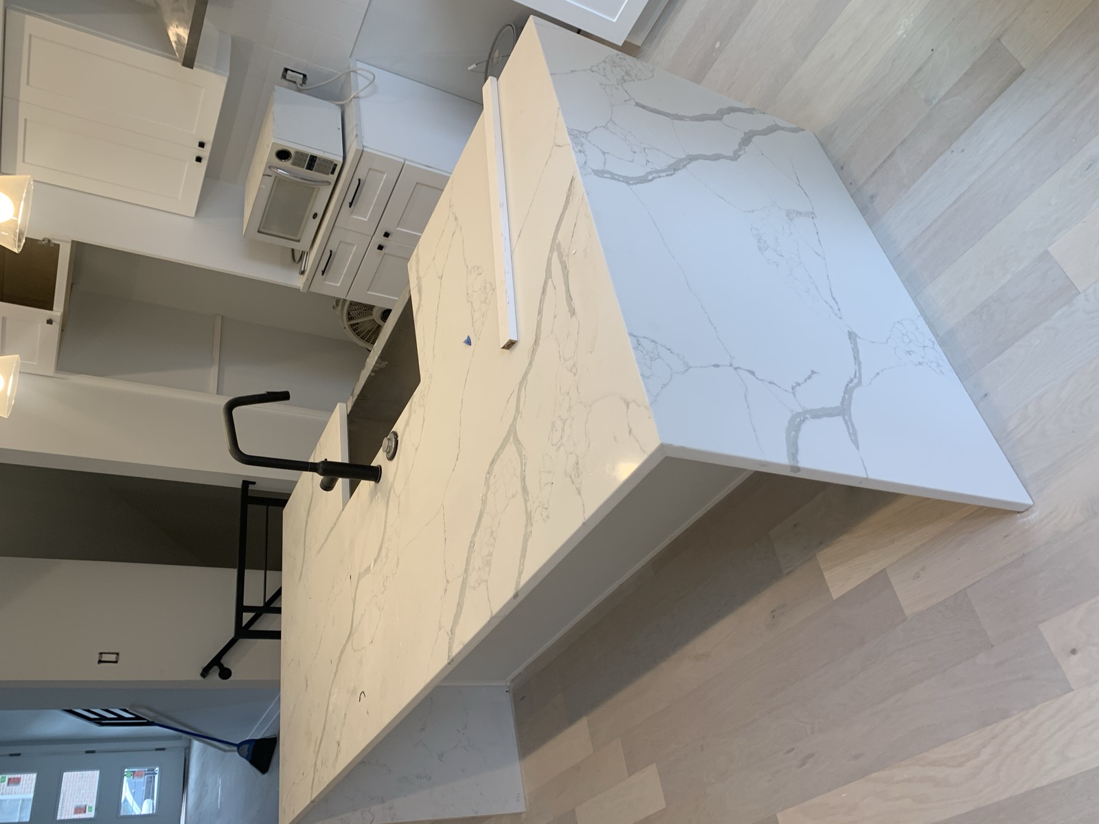 Quartz waterfall island close-up with undermount sink