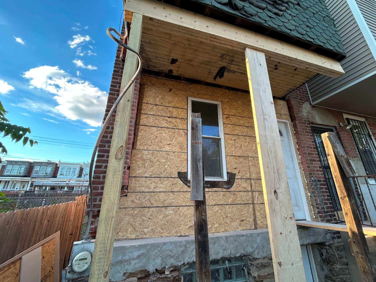 Before: rowhome rear entry with no stairs and temporary support posts