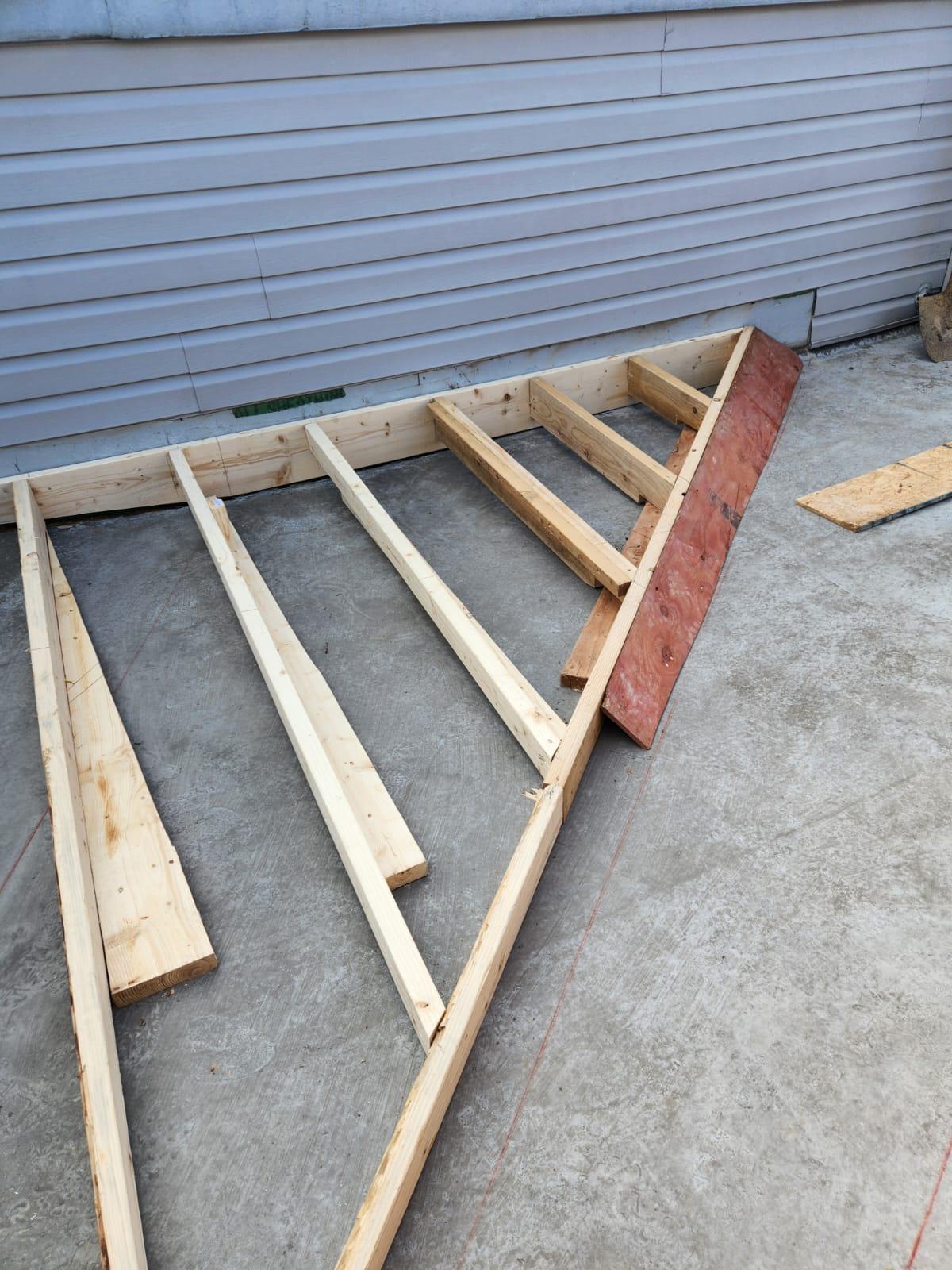 Tapered lumber sleepers framed on a Philadelphia roof deck before sheathing