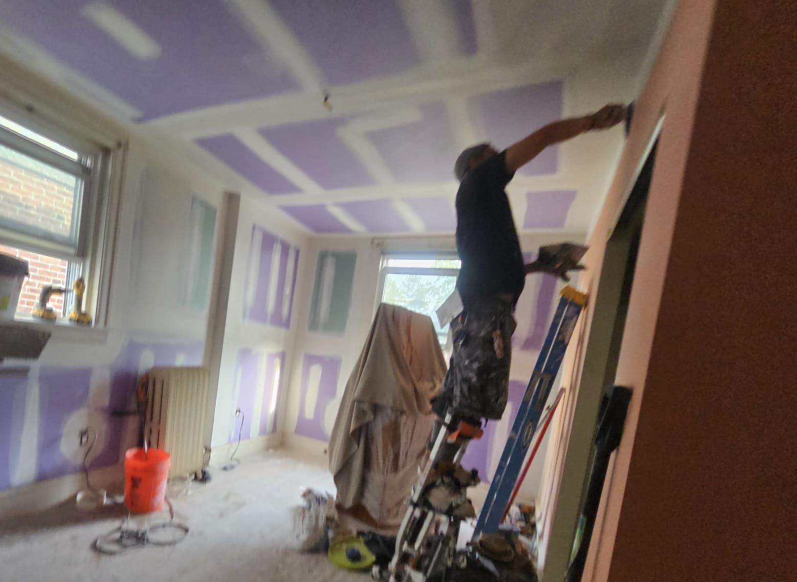 Drywall taping in progress across the bedroom ceiling and walls