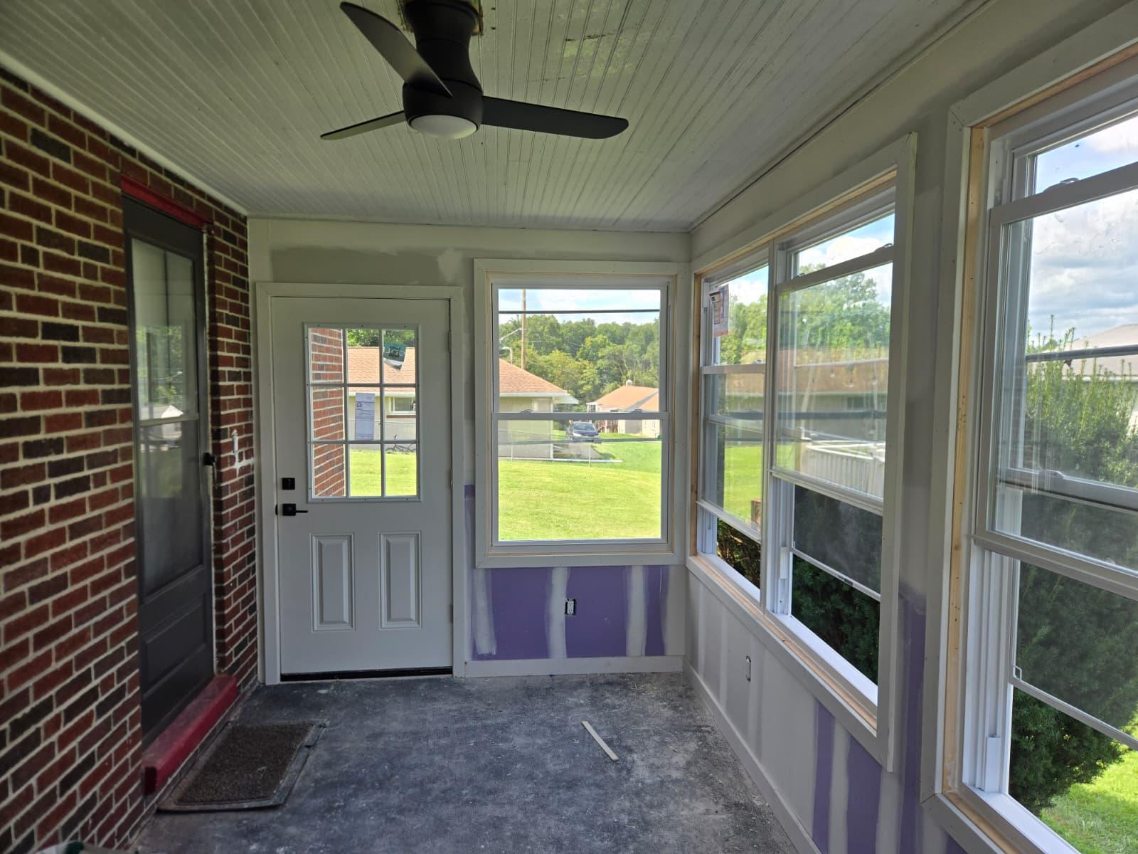 In progress: sunroom walls hung with moisture-resistant drywall and taped