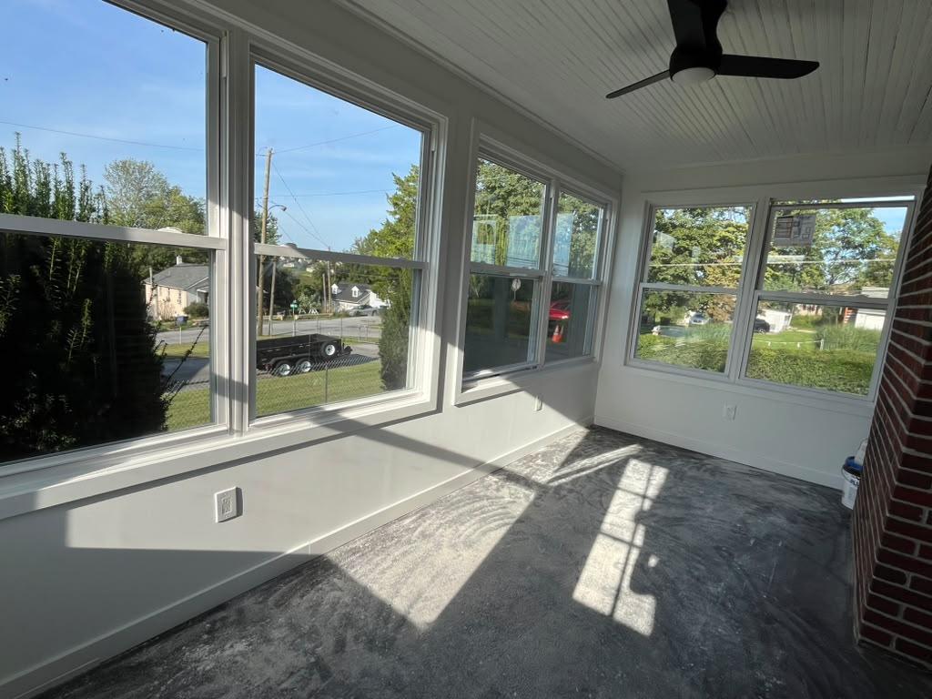 Sunlit window wall in the finished sunroom